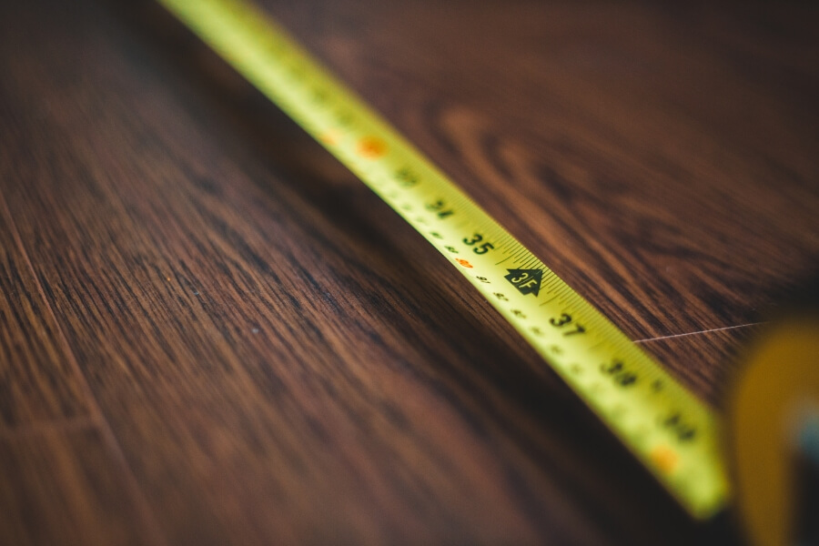measuring tape on a wooden table