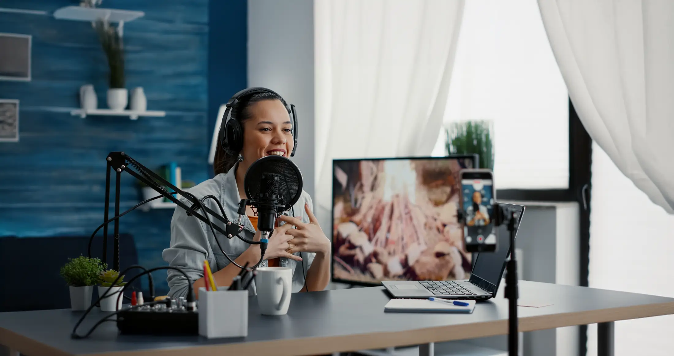 a woman recording a podcast