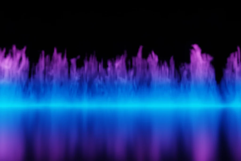 Blurred abstract flames in shades of blue and purple against a black background.