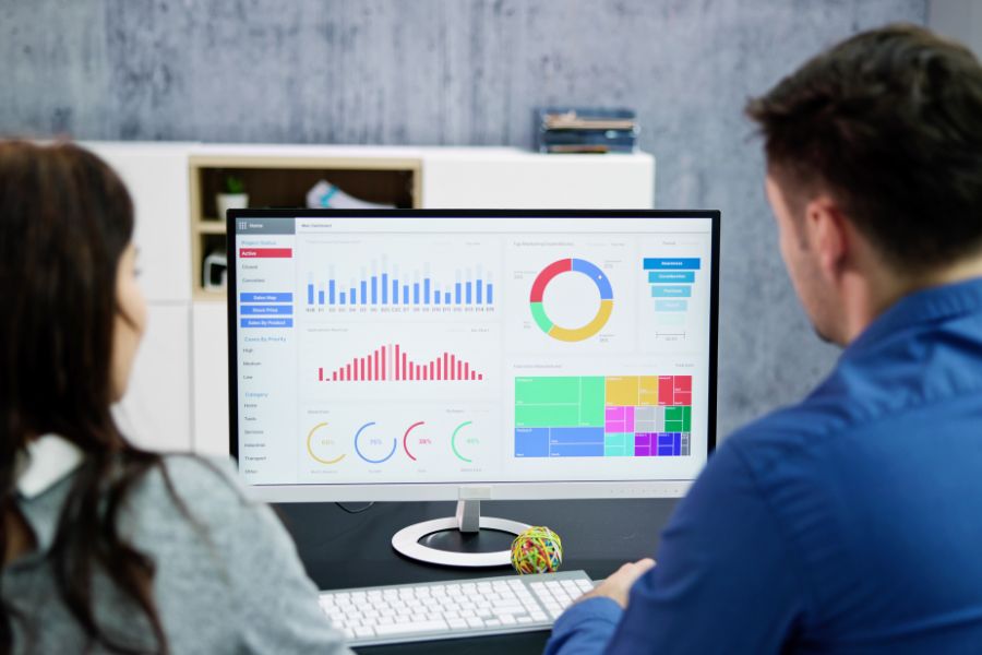 coworkers analyzing business graphs and charts