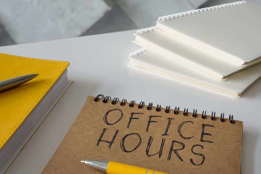 office hours written on the front page of a notebook