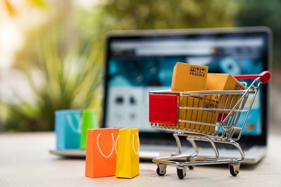 laptop and mini shopping cart