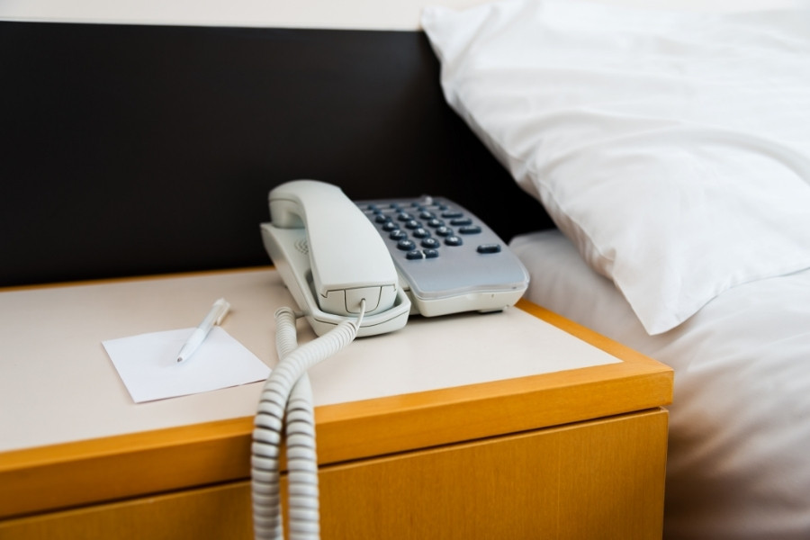 telephone and note in a hotel room